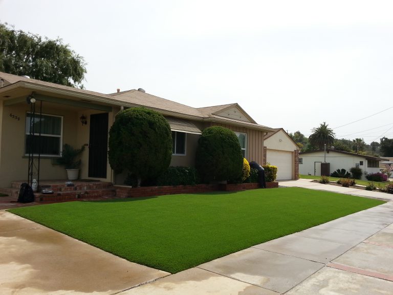 Front yard artificial lawn in front of a single-story home