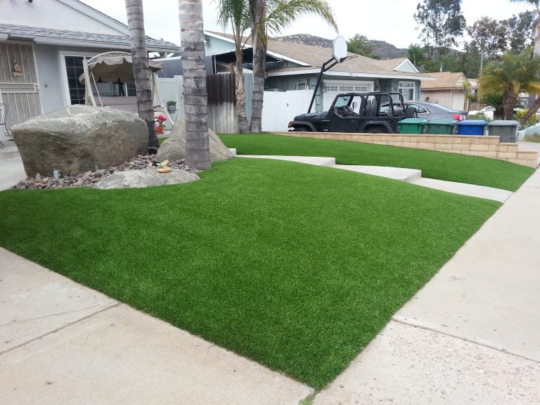 Sloped front yard covered with artificial grass