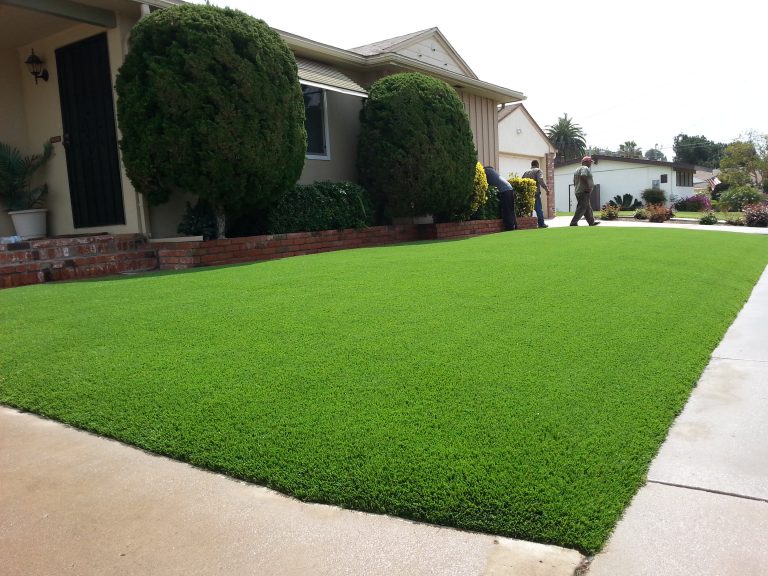 Front yard artificial grass lawn installed along a walkway