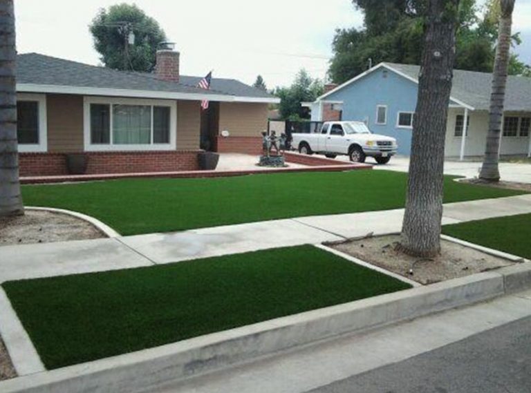 Front yard turf panels framed by concrete